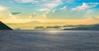 © ABCDstock - Empty asphalt race track road and sea with mountain island landscape at beautiful sunrise