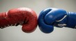 © Volha - Red and Blue Boxing Gloves Confronting Each Other on a Gray Background