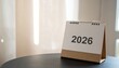 © Altinadewia - Simple white desk calendar displaying the year 2026 for future planning