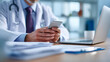 © Arman - Doctor using mobile phone and laptop medical healthcare
