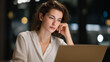 © forenna - A female entrepreneur working late in a sleek co-working space, laptop glow reflecting determination as she finalizes her pitch deck for investors — startup resilience and women driving business