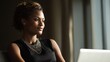 © Popelniushka - Successful Young Businesswoman: An Attractive Black Woman Working Confidently on Her Laptop in a Modern Office Environment