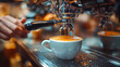 © Андрей Бойко - Close-up of a barista pulling a fresh espresso shot into a white cup using a professional coffee machine, with warm café lighting and shallow depth of field