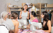 © JackF - Adult female teacher explains to group of women how to sew at sewing master class