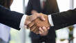 © Artistic Creatives - business people shaking hands in office