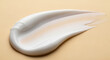 © abu - Close up captures a creamy white swirl on a golden surface, perfect for cosmetic or beauty concepts. The texture is smooth, highlighting lotion or skin care.