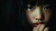 © bephoto - 女の子が涙を流しながら口元を覆う