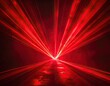 © Fartner - Vibrant red laser beams diverge from a central bright point across a dark space.
