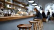 © liliyabatyrova - In a snug cafe, warm light spills over wooden stools and a busy counter filled with tempting pastries. Patrons chat quietly, savoring their drinks and the comforting ambiance