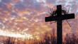 © wang - Silhouette of a wooden cross with crown of thorns against a dramatic sunset sky