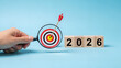 © Rocha Santos - Strategic planning for 2026 with a target and arrow symbolizing goals, objectives, focus, success, and future results in business and personal life.
