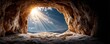 © JT Studio - A stunning view from a cave, showcasing sunlight streaming through an opening, illuminating the rocky interior and contrasting with the blue sky.