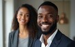 © Emery - Portrait of a smiling black business man and black business woman. High quality