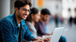 © Kateryna - Faceless happy Indian student and male friend using laptop heavily defocused university campus background anonymous learners with digital collaboration academic technology usage