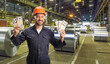 © Ljupco Smokovski - Factory worker wearing a protective helmet and goggles and holding money