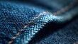 © Mas - Close up denim fabric texture with visible stitching