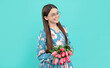 © Olena - floral present. smiling child in glasses with tulips. mothers or womens day. kid hold flowers