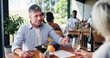 © peopleimages.com - Conversation, couple and wine with man in restaurant together for bonding or relationship. Date, drink and romance with mature person at table in coffee shop for break, connection or hospitality
