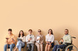 © Pixel-Shot - Job applicants with blind woman and man in wheelchair waiting for interview near beige wall