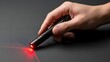 © j - Hand Holding Laser Pointer with Red Beam.