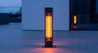 © BackgroundStudio - Modern electric outdoor patio heater glowing brightly on a wooden deck at twilight, providing warmth