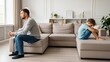 © Tanakorn - Unhappy father and young son sit apart on a modern beige sofa, silent tension highlighting a generation gap after a family quarrel