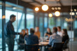 © Art_spiral - Back view of professional male executive leading a business presentation for a team in a modern dimly lit office boardroom with cinematic warm bokeh lights and glass reflection