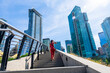 © unai - Woman climbing stairs in downtown vancouver, british columbia
