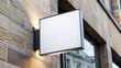 © Songkran - A blank square signboard mockup placed on a stone wall exterior with an empty space for a shop logo