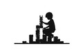 © Atonu - Creative Construction: A silhouette of a young child engrossed in building a tower with interlocking bricks, embodying imagination and learning.