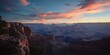 © vxnaghiyev - Grand Canyon at sunrise, showcasing stratified cliffs and the effects of seasonal weather on landscape
