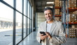 © insta_photos - Happy man warehouse manager, freight forwarder standing near boxes using smartphone. Logistic commercial storage retail goods supply. Storehouse distribution, industrial merchandise and delivery app.