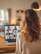 © Johannes - back view of business woman talking to her colleagues about plan in video conference multiethnic business team using laptop for a online meeting in video call group of people smart working from home