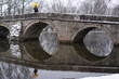 © Jasmin Merdan - Historic Stone Bridge in Snow with Forest Background. High quality photo