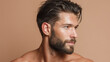 © JoeyMarut - Man with wet hair slicked back soft warm spa light close up masculine face healthy skin brown hair beard bare shoulders looking away relaxed expression