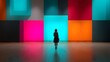 © irawan - Silhouette of a person standing in front of colorful illuminated squares.