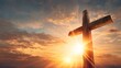 © irawan - Cross against a sunset sky symbolizing faith and hope.