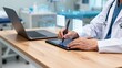 © Dax‌ - Doctor using digital tablet in clinic
