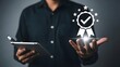 © Rahima - Man holding tablet with verification badge and stars