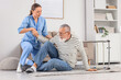 © Pixel-Shot - Nurse helping senior man after fall with walker at home