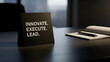 © Tania - A motivational sign with the words innovate, execute, lead on an office desk