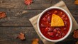 © LoFi J. - Autumnal Still Life with Crimson Stew and Golden Bread on Rustic Wooden Surface.