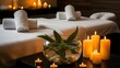 © R.A.N world - romantic spa massage room with candles and soft lighting creating tranquil atmosphere for relaxation and wellness treatments with rolled towels on beds.