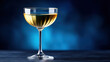 © Oatkhaphon - Fluid golden liquid movement in cocktail glass shines brightly with elegant reflection on dark blue background