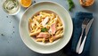 © Austin - penne pasta with salmon in creamy sauce bright natural lighting minimal styled overhead composition