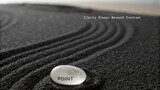 Serene Zen Stone Resting on Black Sand with Gentle Wavy Patterns Invoking Calmness and Tranquility in Nature's Design