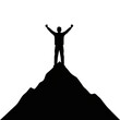 © mobil - Man standing on mountain peak with arms raised in triumph