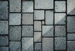 © AFFANYUDA - Gray pavers, some moss, overhead view, diagonal light