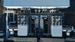 © Liam Carter - Aerial drone top down rotating view of cooling and ventilation systems on a data storage center warehouse building showing modern infrastructure.