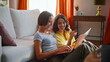 © stockbusters - Enthusiastic girls creating startup at home sitting floor near couch closeup.